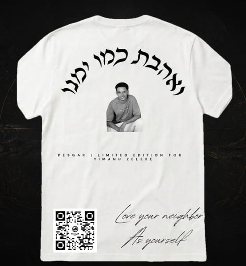 White t-shirt with black text and a QR code on a dark background
